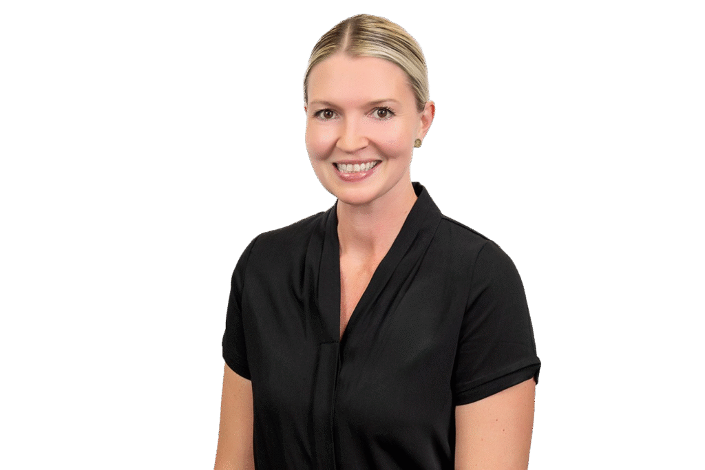 A woman with blond hair pulled back, wearing a short-sleeved black blouse, smiles at the camera against a plain white background—an inviting image for music therapy courses on the Gold Coast.